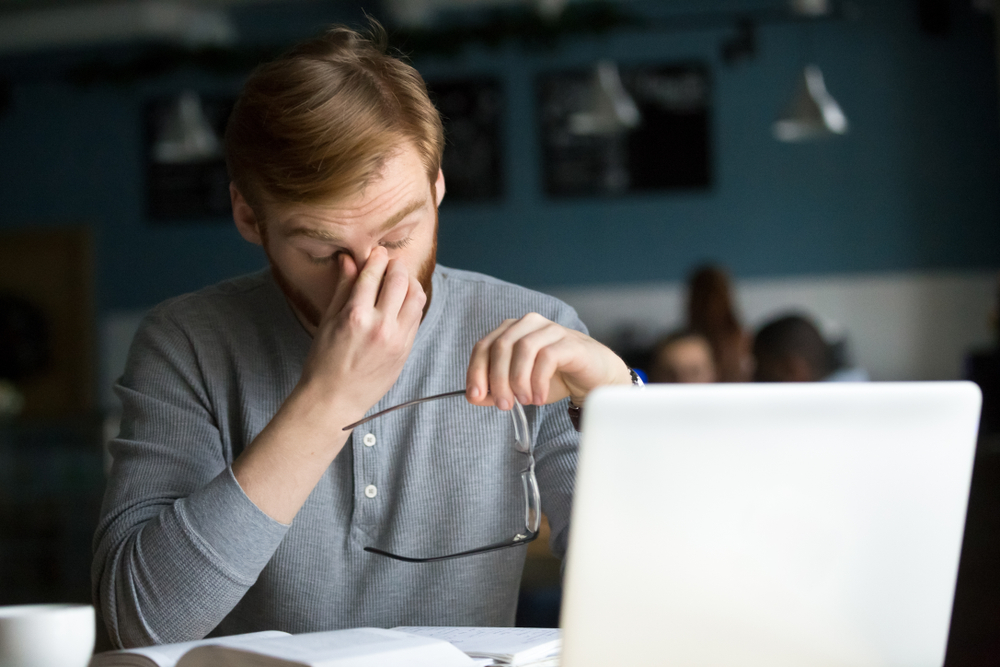 Man experiencing eye strain